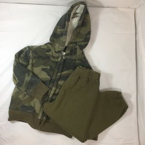 Camo jacket and green sweatpants